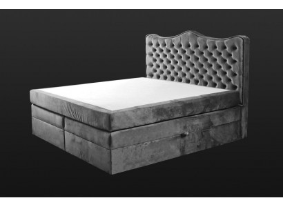 Cadre de lit gris style chesterfield. Design de chambre élégant. Meubles classiques en tissu.